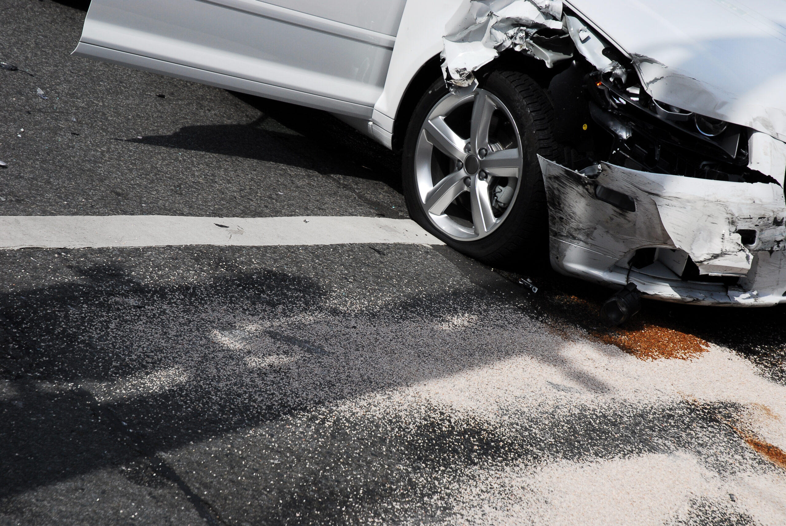 A white car just involved in a car crash in Marietta, GA - Call Bridger Law Group for a free consultation